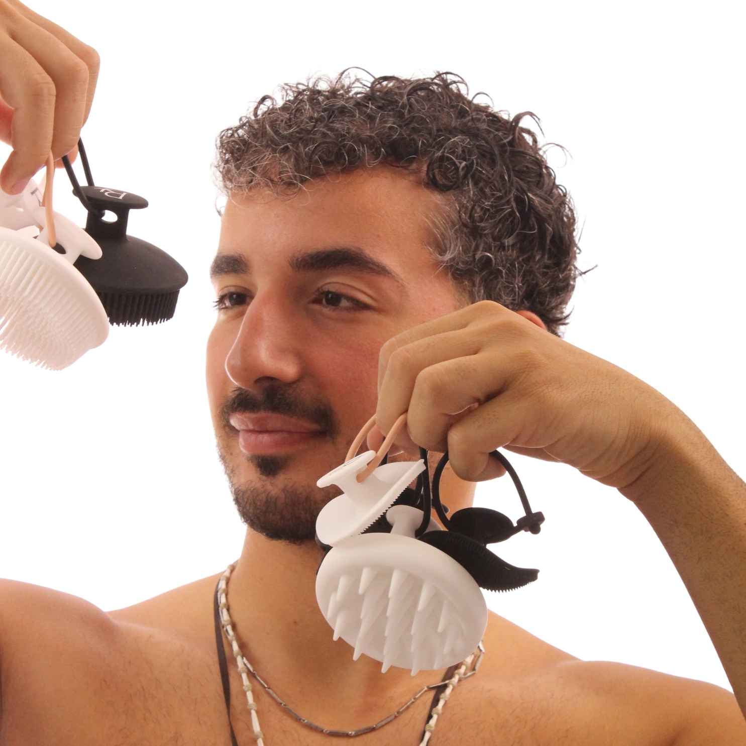 Model holding all Raqiia Brushes