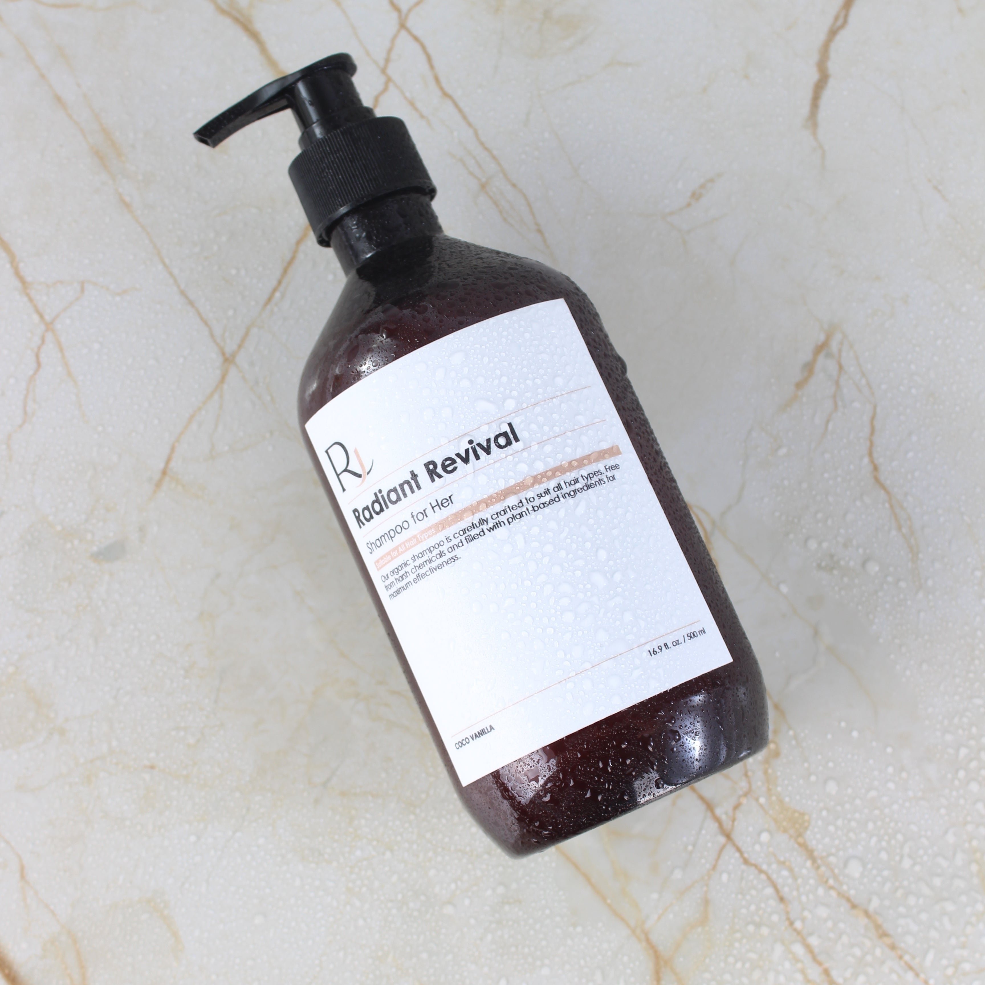 Bottle of 'Raqiia Radiant Revival' product on a marble surface
