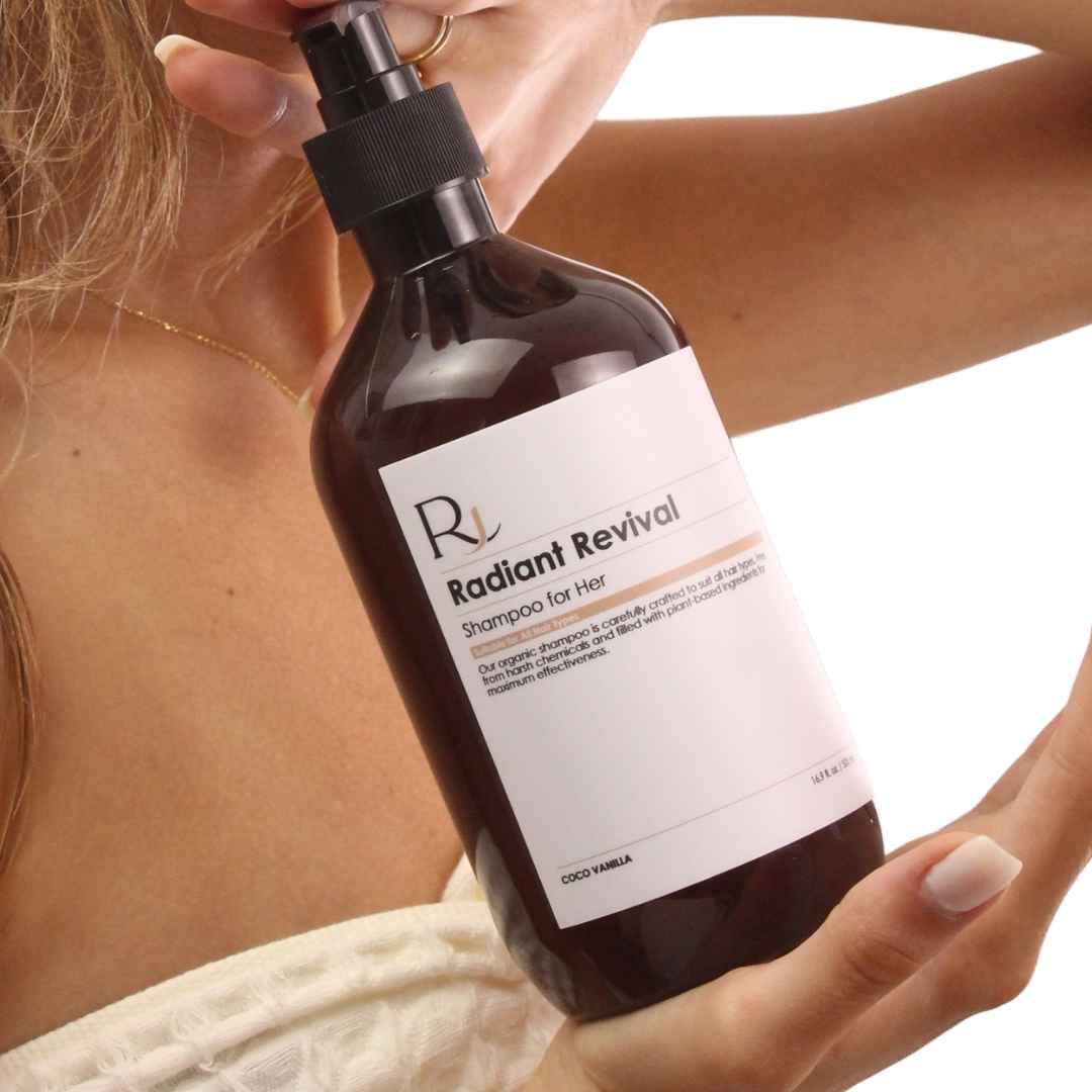 Bottle of 'Raqiia Radiant Revival' shampoo held by a woman with a neutral background