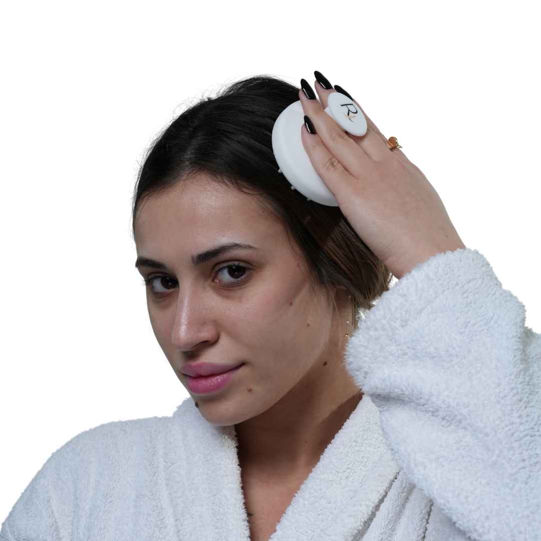 Male Model using White Raqiia Scalp Massager in front of white background
