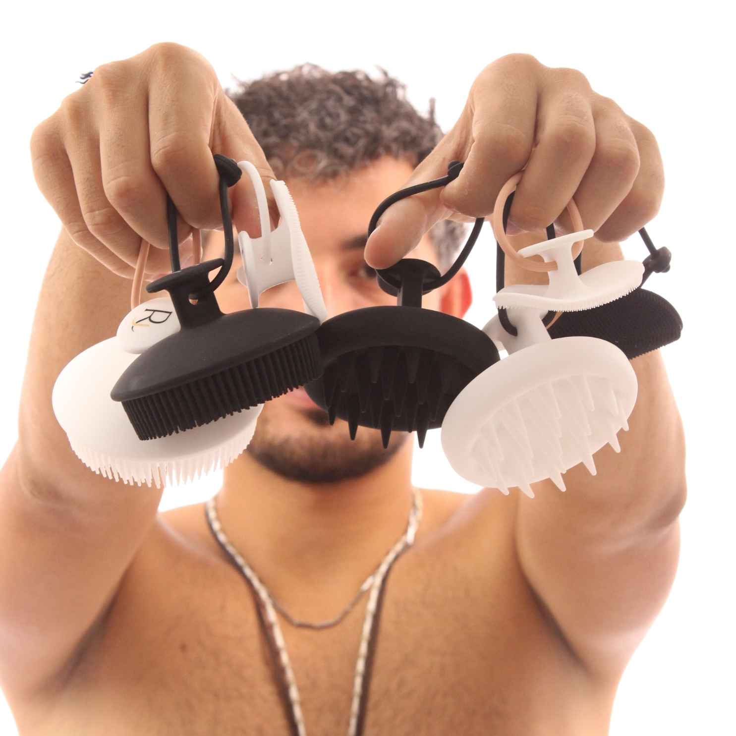 Model holding all Raqiia Brushes