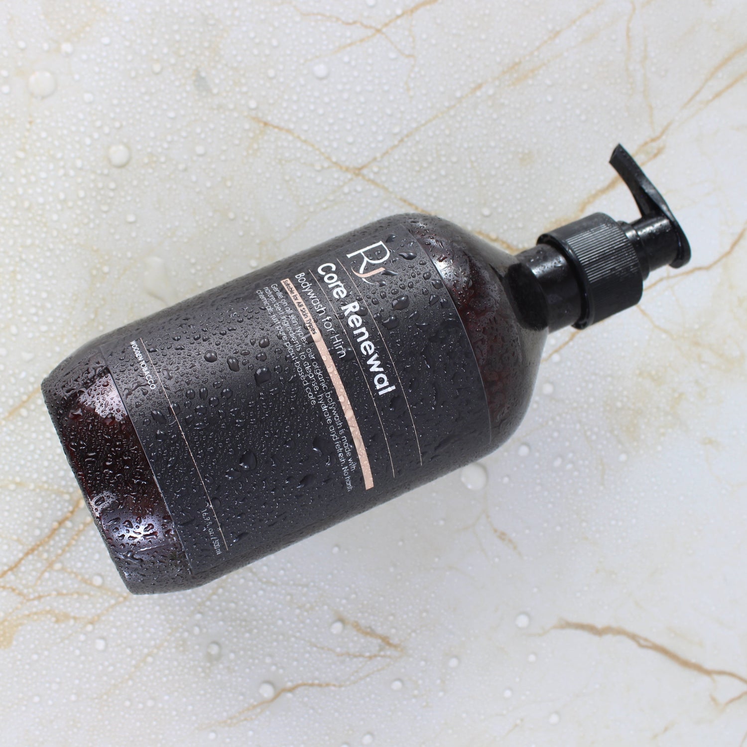 Raqiia Core Renewal Bodywash on gold marble