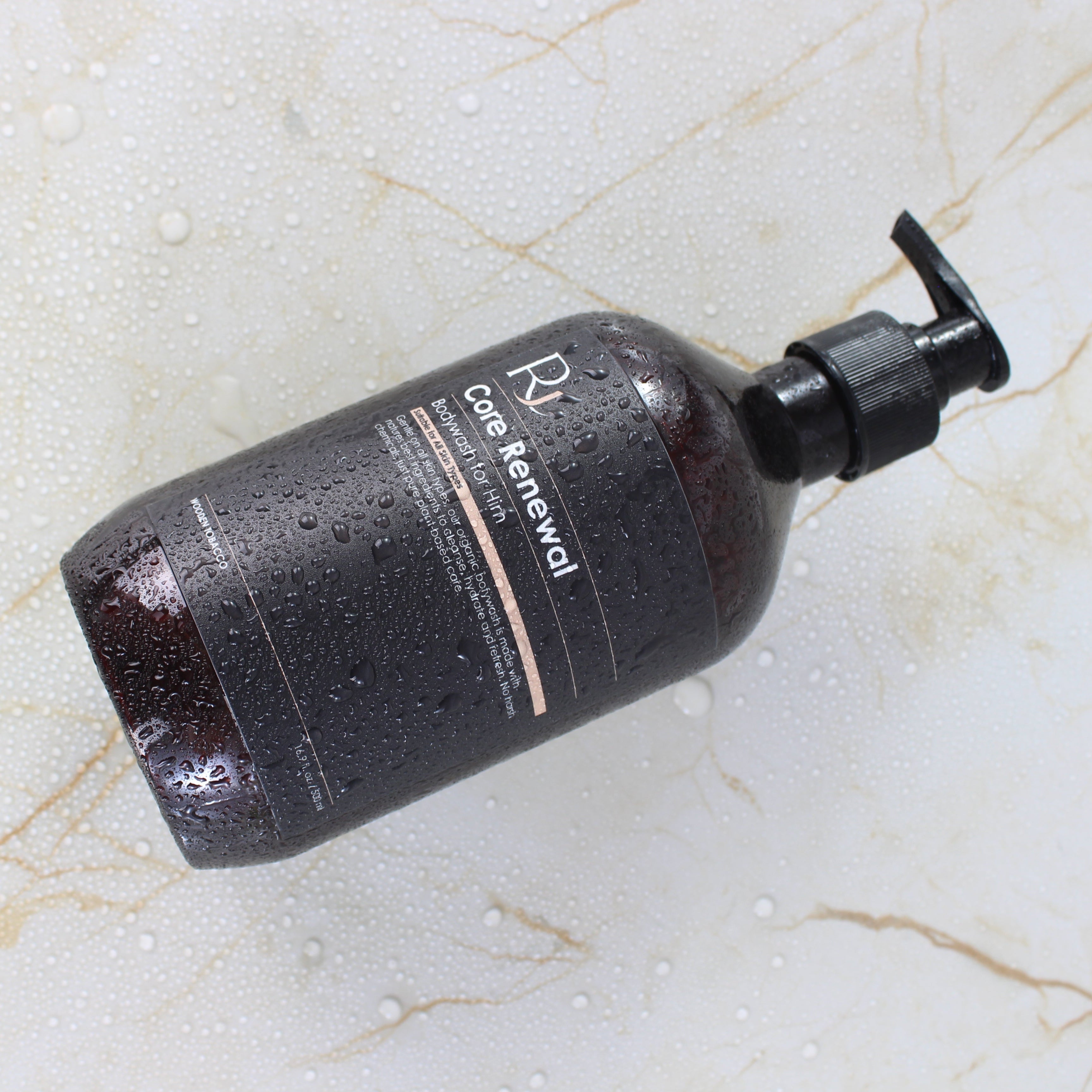 Raqiia Core Renewal Bodywash on gold marble