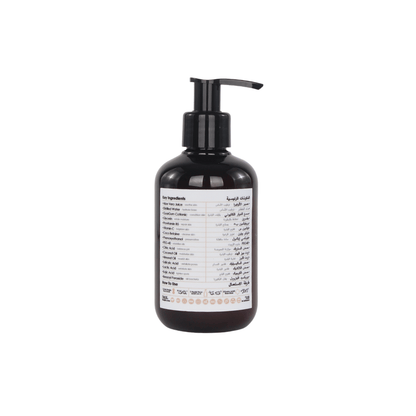 Bottle of Raqiia Crystal Cleanse Facewash a pump and label on a white background