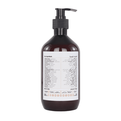 Bottle of front of Raqiia Radiant Revival shampoo for her with pump on a white background