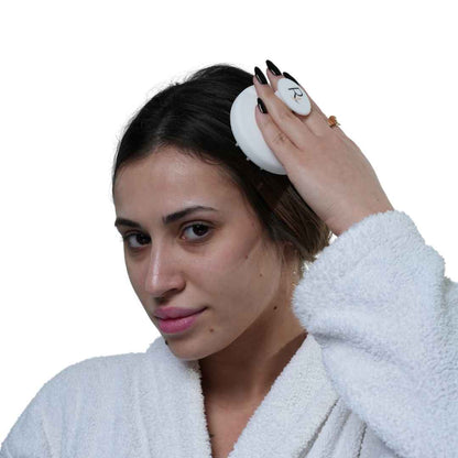 Male Model using White Raqiia Scalp Massager in front of white background