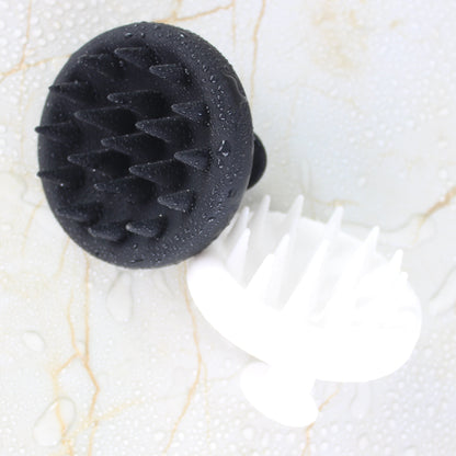 Black and White Raqiia Scalp Massagers on gold marble