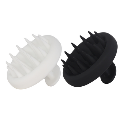 White and black Raqiia scalp massager on a white background